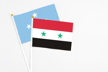 Syria and Micronesia stick flags on white background. High quality fabric, miniature national flag....