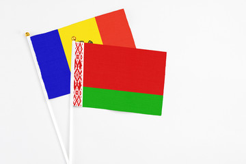 Belarus and Moldova stick flags on white background. High quality fabric, miniature national flag. Peaceful global concept.White floor for copy space.