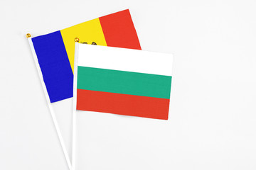 Bulgaria and Moldova stick flags on white background. High quality fabric, miniature national flag. Peaceful global concept.White floor for copy space.