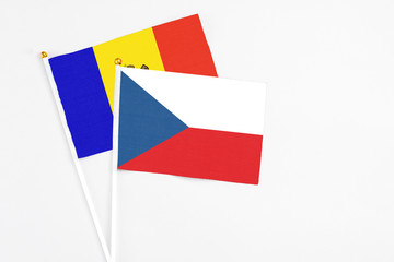 Czech Republic and Moldova stick flags on white background. High quality fabric, miniature national flag. Peaceful global concept.White floor for copy space.