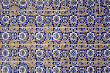 Wall with traditional Portuguese decor tiles azulezhu in blue tones.