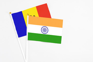 India and Moldova stick flags on white background. High quality fabric, miniature national flag. Peaceful global concept.White floor for copy space.