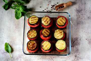 Grilled vegetables: tomatoes, eggplant on a glass dish