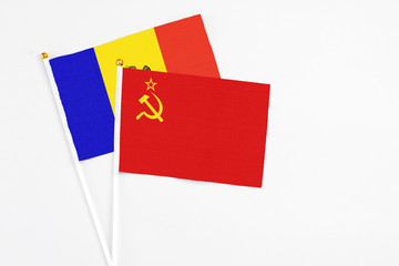Soviet Union and Moldova stick flags on white background. High quality fabric, miniature national flag. Peaceful global concept.White floor for copy space.