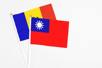 Taiwan and Moldova stick flags on white background. High quality fabric, miniature national flag. Peaceful global concept.White floor for copy space.