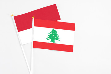 Lebanon and Monaco stick flags on white background. High quality fabric, miniature national flag....