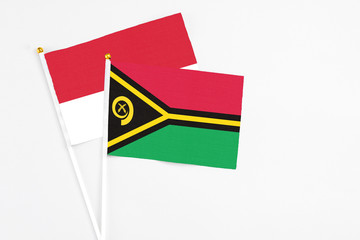 Vanuatu and Monaco stick flags on white background. High quality fabric, miniature national flag....