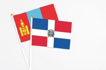 Dominican Republic and Mongolia stick flags on white background. High quality fabric, miniature national flag. Peaceful global concept.White floor for copy space.