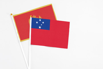 Samoa and Montenegro stick flags on white background. High quality fabric, miniature national flag. Peaceful global concept.White floor for copy space.