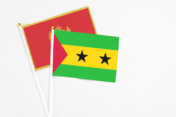 Sao Tome And Principe and Montenegro stick flags on white background. High quality fabric, miniature national flag. Peaceful global concept.White floor for copy space.