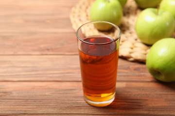 juice from green apples on the table.