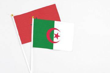 Algeria and Morocco stick flags on white background. High quality fabric, miniature national flag....