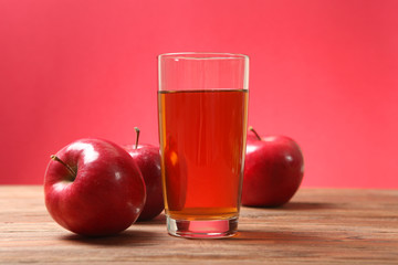 apple juice from red apples on the table. 