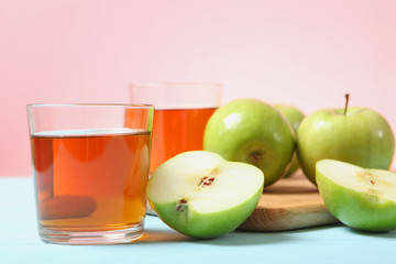juice from green apples on the table.