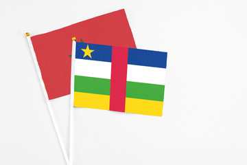 Central African Republic and Morocco stick flags on white background. High quality fabric, miniature national flag. Peaceful global concept.White floor for copy space.