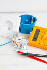 digital multimeter, electrical outlet and circuit breaker