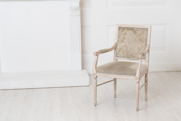 Fototapeta na wymiar White old-fashioned retro style chair standing in an empty room