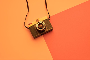 Minimal fashion, Trendy film camera, summer vibration on orange geometry background. Hipster...