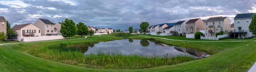 Panorama view of a community pond in an estate