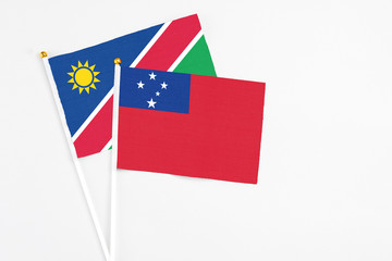 Samoa and Namibia stick flags on white background. High quality fabric, miniature national flag....