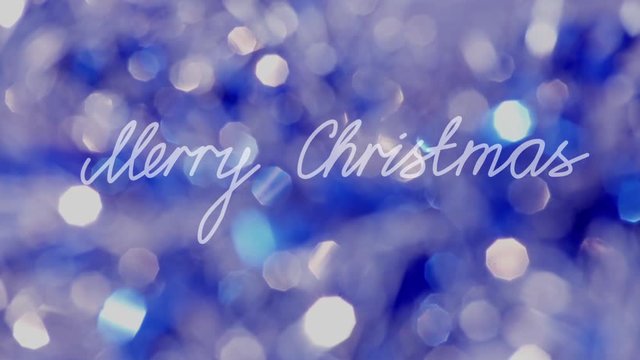 "Merry Christmas" Text agaist Glowing Bokeh Backround