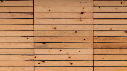 Obraz premium fondo simétrico de un muro de madera