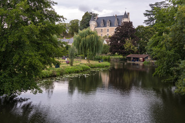 Fototapeta premium The beautiful village of Montresor bathed by the Indrois river, located in the Loire Valley.
