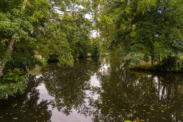 The beautiful village of Montresor bathed by the Indrois river, located in the Loire Valley.