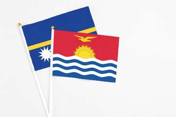 Kiribati and Nauru stick flags on white background. High quality fabric, miniature national flag....