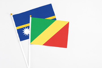 Republic Of The Congo and Nauru stick flags on white background. High quality fabric, miniature...