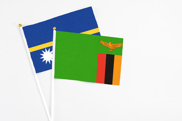 Zambia and Nauru stick flags on white background. High quality fabric, miniature national flag....