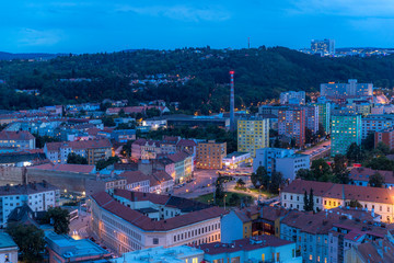 Fototapeta premium Housefly - Musca domestica close-up macro view while flying in smoke on head eyes and body with outstretched wings in the air on dark background.