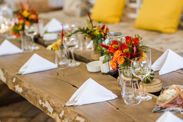 Beautiful autumn colored taable decoration for a special event. Fresh flower table decoration.