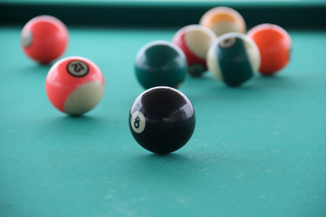 billiard balls on pool table