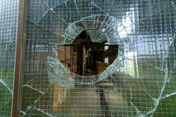 Broken glass in the window of warehouse