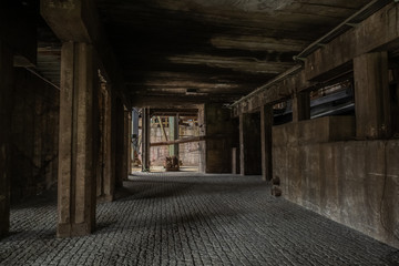 Fototapeta na wymiar Interior of abandoned industrial warehouse