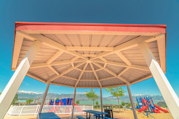 Octagon shape pavilion and playground with lake and Timpanogos mountains view