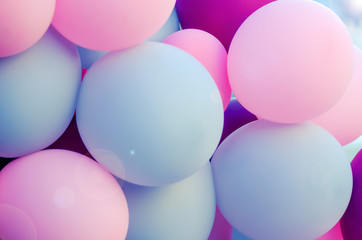 many balloons for the holiday of pleasant colors. pink, light, purple. atmosphere of celebration, relaxation. sun flare. Background for wedding, anniversary, birthday.