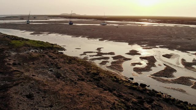 Boats On Moored On Sandbar In Tidal Estuary At Dawn Aerial Landscape Wells-Next-The-Sea Low Tide