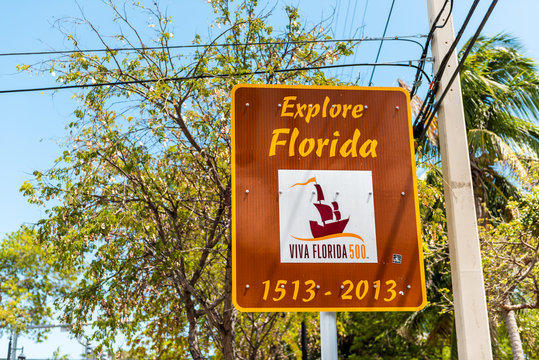 Key West, USA - May 1, 2018: Historic Viva Explore Florida 500 anniversary celebration sign in city island on travel, sunny day, street with 2013 date