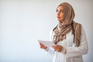 Portrait Of Smiling Muslim Female Doctor. Confident female nurse. Closeup portrait of friendly,...