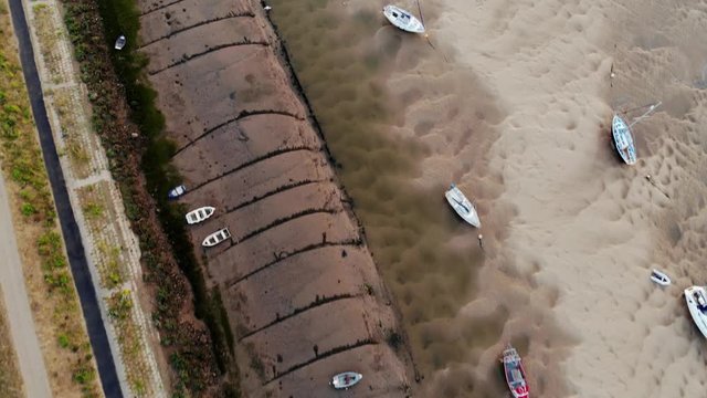 Bird's Eye View Boats Beached on Sandbar in Estuary At Low Tide Aerial Landscape