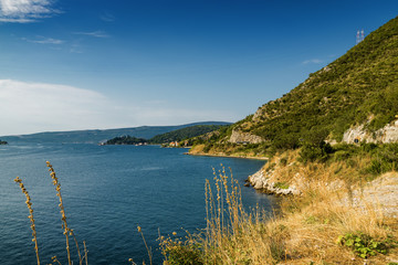 Sunny morning view of the Boka Kotor bay and its islands from above, somewhere near Perast, Montenegro.