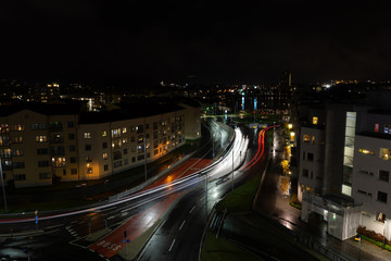 Fototapeta na wymiar Lights from car. Car in roundabout. Night. Lights. Traffic during night.