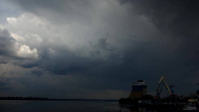 thunderclouds and bridge over the river
