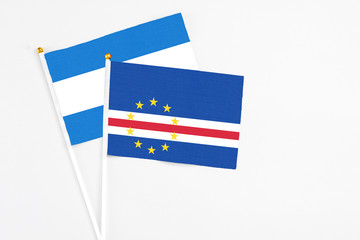 Cape Verde and Nicaragua stick flags on white background. High quality fabric, miniature national flag. Peaceful global concept.White floor for copy space.