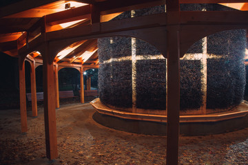 Brine graduation tower in Krynica Zdrój. Place where you breathe iodine. Improving respiratory and thyroid health. Climate autumn night in the park with a graduation tower.