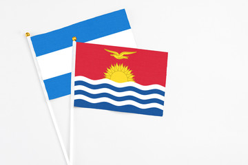 Kiribati and Nicaragua stick flags on white background. High quality fabric, miniature national flag. Peaceful global concept.White floor for copy space.