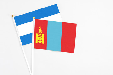 Mongolia and Nicaragua stick flags on white background. High quality fabric, miniature national flag. Peaceful global concept.White floor for copy space.