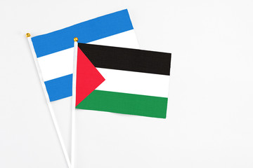 Palestine and Nicaragua stick flags on white background. High quality fabric, miniature national...